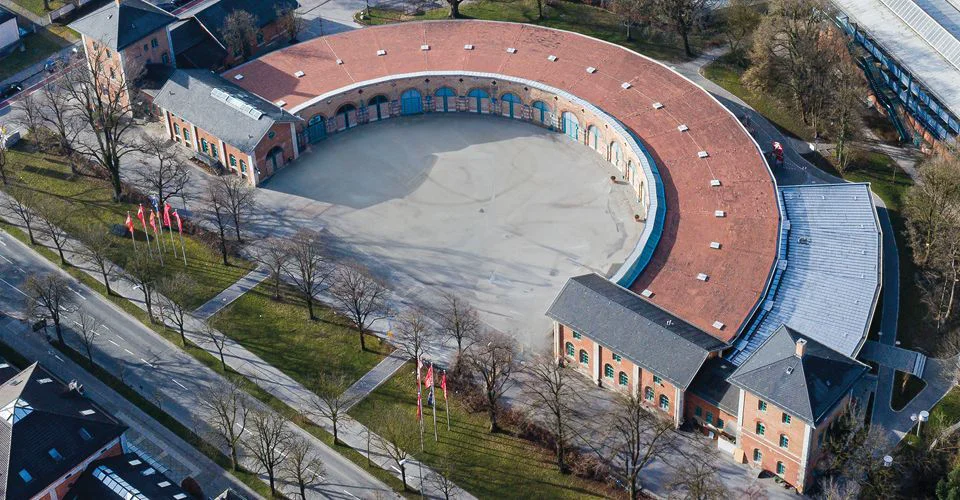The Lokschuppen Rosenheim from the air, a semicircular former locomotive shed